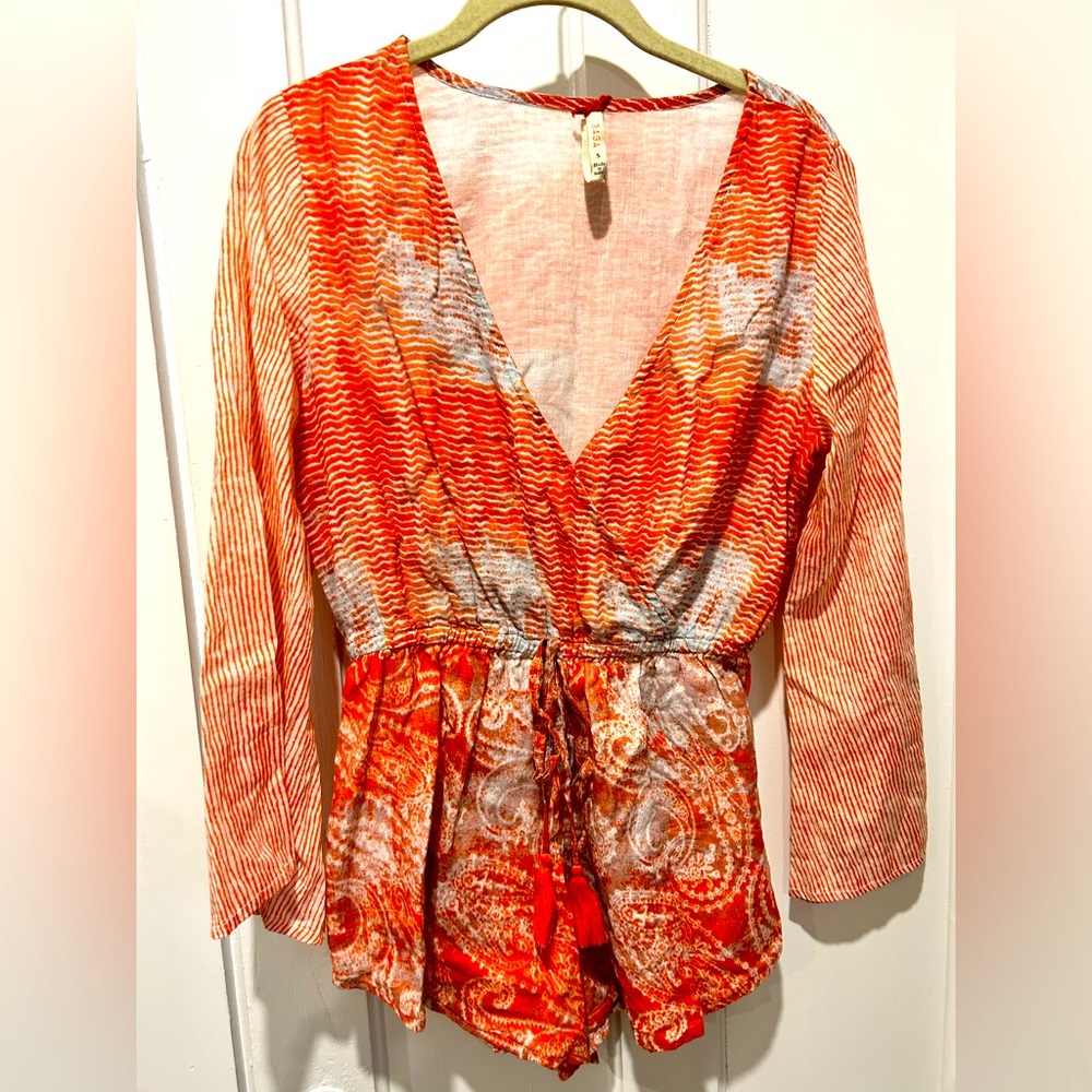Romper Size Small with tassels for added decoration at waist!